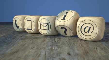 Wooden cubes with the contact icons on the wooden table. 3d illustration.の写真素材