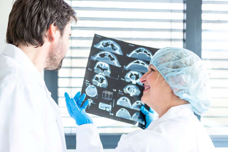 Two doctors with an X-ray.の写真素材