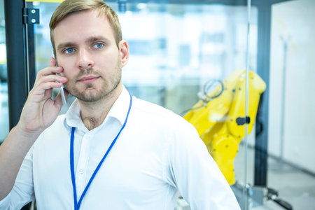 Engineer maintaining the industrial robots.