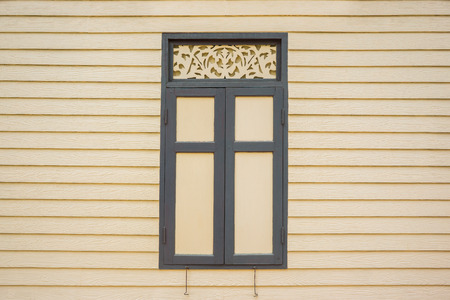 Vintage window on wooden wallの写真素材