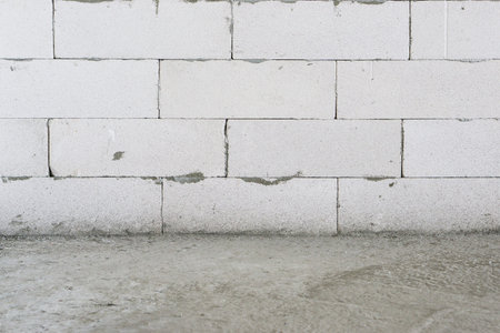 Unfinished concrete wall with floorの写真素材