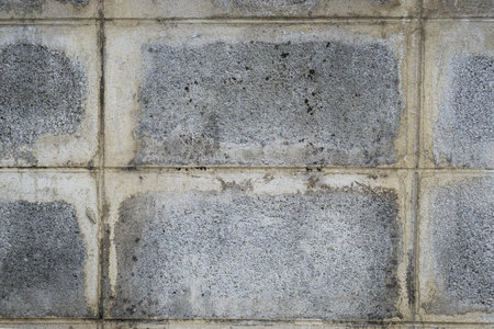 Old and scratch concrete block wall