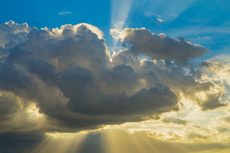 Rays of light shining through cloudsの写真素材