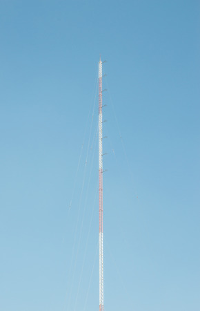 Really tall antenna tower on the clear blue skyの写真素材