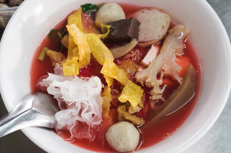 Yen Ta Fo, authentic Thai-style noodle soup with fish balls, crispy wonton skin, pork blood, jelly...