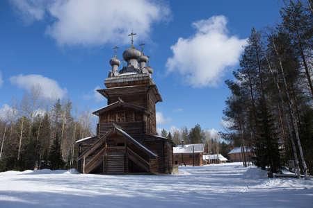 winter snow shot of russian wooden traditional orthodox church and chapel in the nrthern open air museum Malye Korely near Arkhanglesk, Primorsk Region, Russiaのeditorial素材