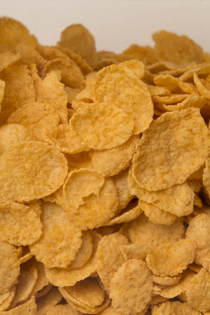 pile of cereal corn flakes background close up filled frame copy space wallpaper shot