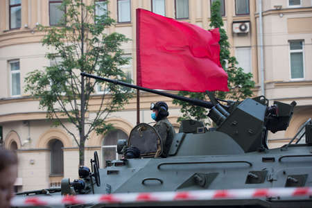Moscow, Russia - 18.06.2020 Victory Day Parade rehearsal. Tankman soldier on a gun turret of a Russian army military armored vehicle tank at Sadovaya street (garden Ring)のeditorial素材