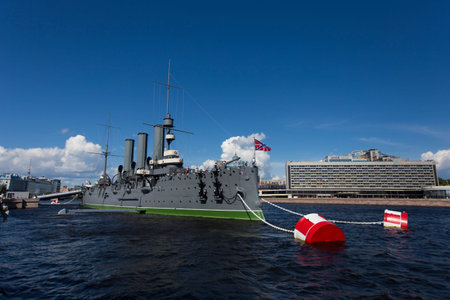 SAINT PETERSBURG, RUSSIA 08/13/2021 side view of Cruiser Aurora with naval jack flag and forecastle...