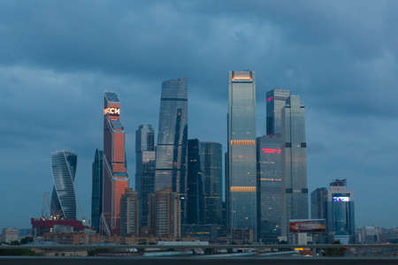 MOSCOW, RUSSIA - 06/20/2020 Moscow City business and finance center complex with skyscrapers, towers, modern glass office buildings on a blue twilight cloudy dusk dayのeditorial素材