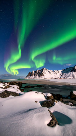 Magical green aurora borealis northern light in night sky over winter landscape with snow and mountain. beautiful, tranquil sceneの素材