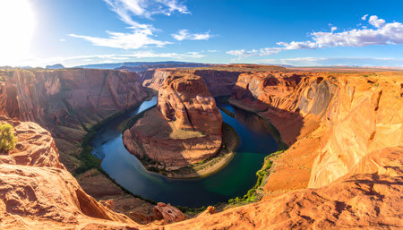 An awe inspiring panoramic scenic view of horseshoe bend, famous outdoor canyon landscape in arizona. colorado river flows through magnificent red rock formationの素材