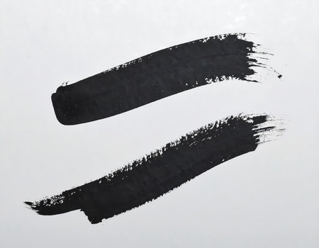 An expressive black ink brush stroke with paint texture. an abstract art element on white background, perfect for minimalist creative designの素材