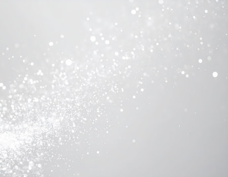 An elegant white silver glitter background with sparkling bokeh light. magical abstract design for serene christmas or winter celebrationの素材