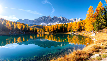 A beautiful autumn landscape with scenic mountain forest reflected in clear lake water. tranquil and peaceful nature scene perfect for travel and tourism backgroundsの素材