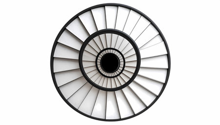 A modern spiral staircase top view creating an abstract architectural pattern. black and white circular design evokes hypnotic feeling of vertigo and endless descentの素材