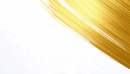 Gold paint brush stroke on white background. An elegant, abstract golden texture art with luxurious feel. Perfect for festive design or creative project with copy spaceの素材