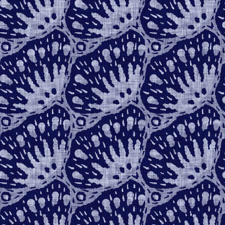 Indigo blue flower block print dyed linen texture background. Seamless woven japanese repeat batik pattern swatch. Floral organic distressed blur block print all over textile.の写真素材