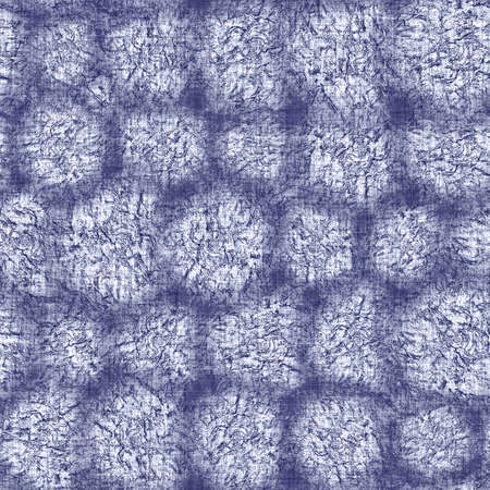Seamless indigo doodle dot texture. Blue woven boro cotton dyed effect background. Japanese repeat batik resist wash pattern. Distressed dotted dye spot. Asian all over cloth print.の写真素材
