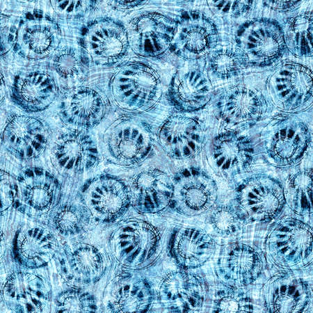 Seamless indigo block print texture on navy blue woven effect background. Japanese style washed denim batik resist pattern. Worn masculine cloth print swatch.の写真素材