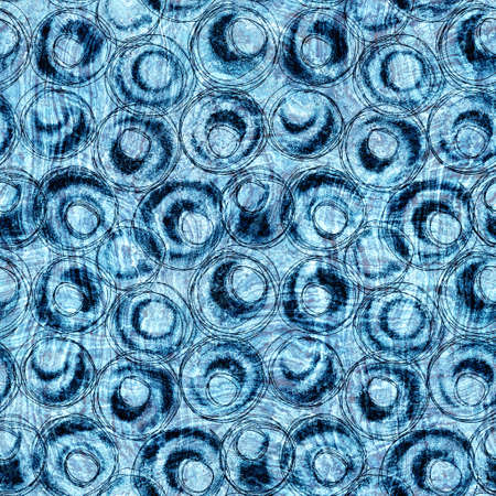 Seamless indigo block print texture on navy blue woven effect background. Japanese style washed denim batik resist pattern. Worn masculine cloth print swatch.の写真素材