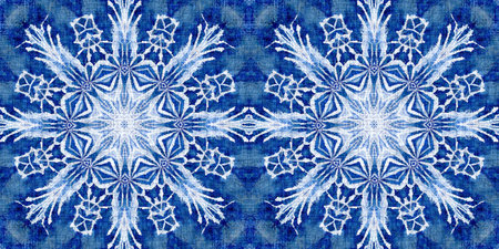 Indigo blue snow flake border background. Frosty batik painterly effect seamless edging. Festive...