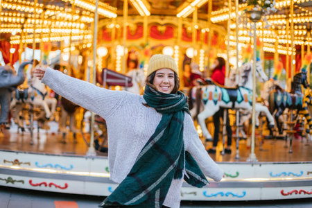 Young girl with yellow wool cap and scarf at a Christmas fair