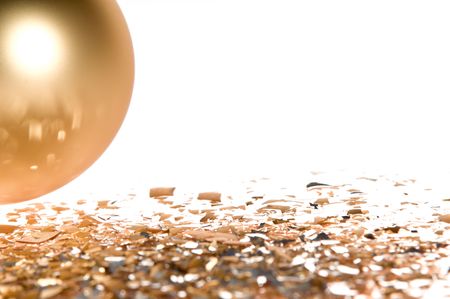 Gold Christmas ball isolated on white background with glass splintersの写真素材
