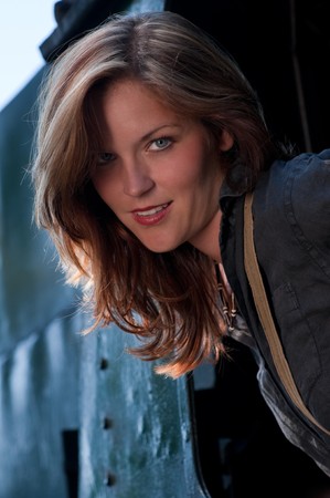 Portrait of beautiful fashion model watching out of the trainの写真素材
