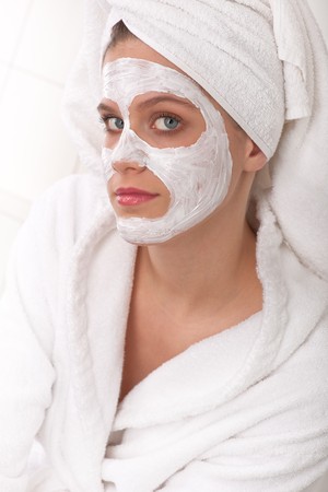 Young woman with facial maskの写真素材