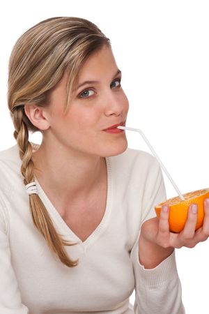 Woman holding orange on white backgroundの写真素材
