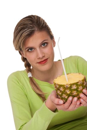 Woman holding pineapple with straw on white backgroundの写真素材