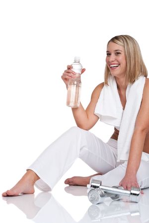 Woman with weights and bottle of water on white backgroundの写真素材