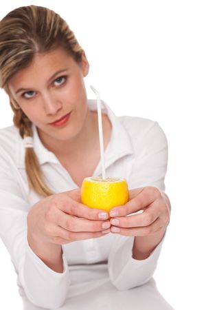 Woman holding lemon on white background, focus on handsの写真素材