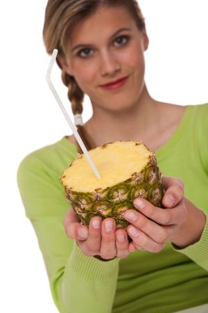 Woman holding pineapple on white background, focus on handsの写真素材