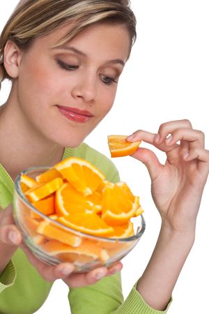 Healthy lifestyle series - Woman with orange on white backgroundの写真素材