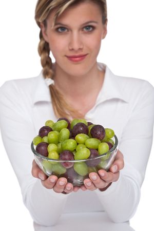 Healthy lifestyle series - Woman holding boxl of grapes on white backgroundの写真素材