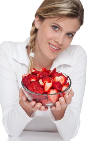 Healthy lifestyle series - Woman holding bowl of strawberries on white backgroundの写真素材