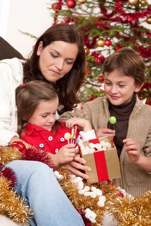 Happy family: mother with son and daughter on Christmasの写真素材
