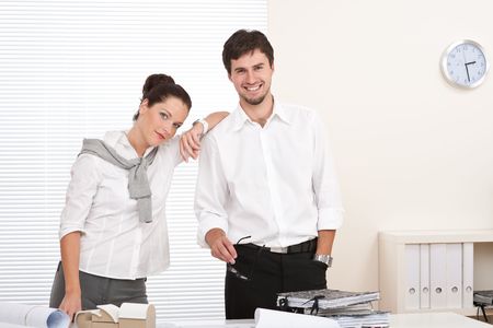 Professional businessman and businesswoman at the office working togetherの写真素材