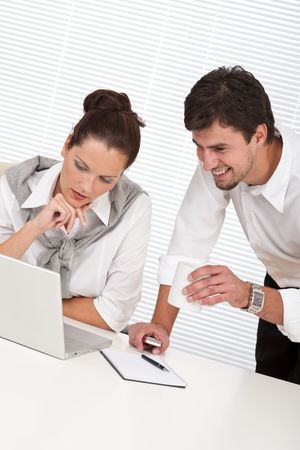 Professional businessman and businesswoman at the office working togetherの写真素材