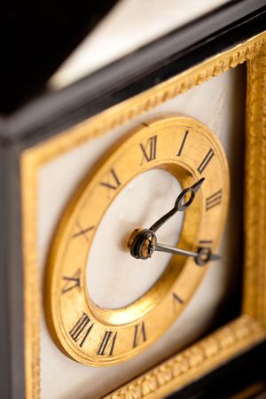Detail of antique gold and black clock with Roman numeral, macro lensの写真素材