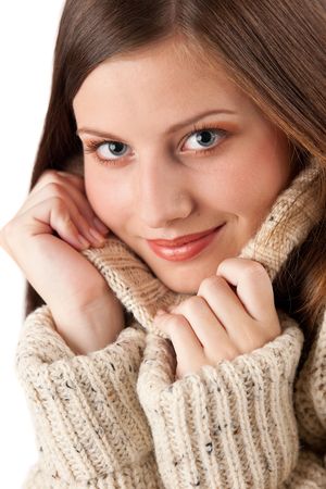 Portrait of beautiful young woman wearing turtleneck on white backgroundの写真素材