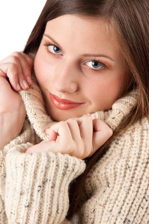 Portrait of beautiful young woman wearing turtleneck on white backgroundの写真素材