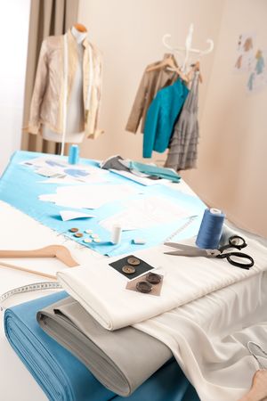 Fashion designer studio with professional equipment, sketches, mannequin, clothの写真素材
