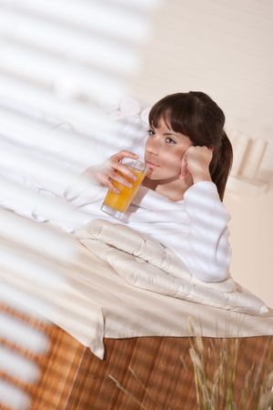 Spa - Young woman at wellness therapy relaxing after massageの写真素材