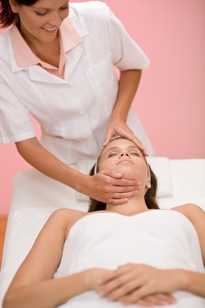 Body care - woman facial massage at day spaの写真素材