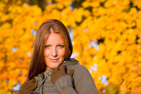 Autumn sunset park - red hair woman fashion in nature