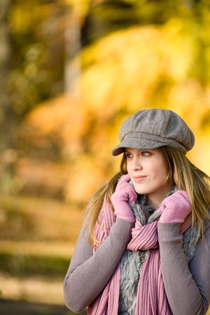 Autumn park - fashion model woman wear cap on sunny dayの写真素材