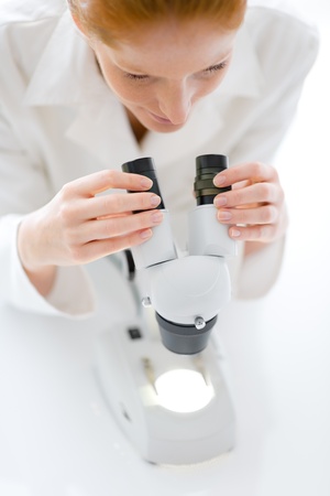 Microscope laboratory - woman medical research chemist experiment, shallow depth-of-fieldの写真素材